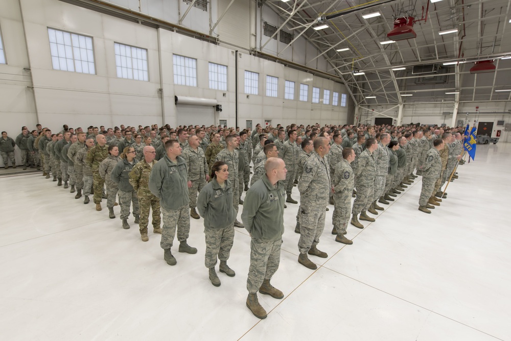 Airmen stand at ease in formation