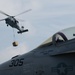 An MH-60S Knight Hawk, with Helicopter Sea Combat Squadron (HSC) 14, delivers ammunition to the flight deck of the Nimitz-class aircraft carrier USS John C. Stennis (CVN 74) during a vertical replenishment.