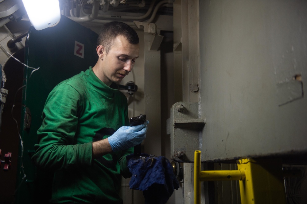 Airman Chevy Foster, from Oroville, California, performs maintenance on an Integrated Catapult Control Station aboard the Nimitz-class aircraft carrier USS John C. Stennis (CVN 74).