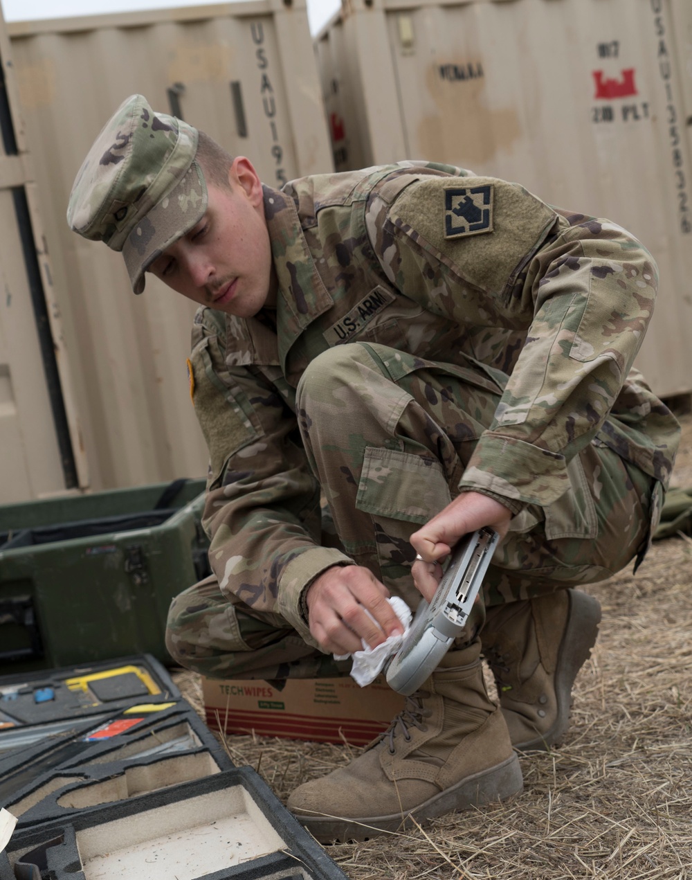 A Soldier Cleans Tools