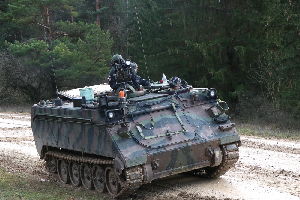 Soldiers attached to 1st Battalion of the 4th Infantry Regiment maneuver an M113A3 during Combined Resolve XI 