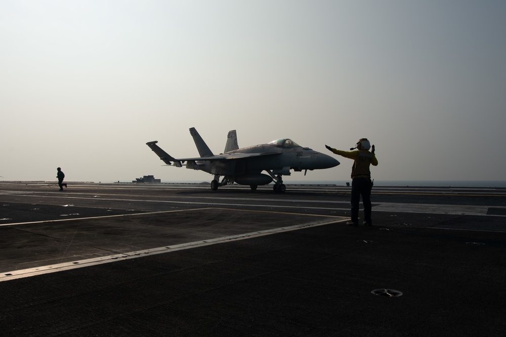 An F/A-18E Super Hornet, with Strike Fighter Squadron (VFA) 97, taxies after landing on the flight deck aboard the Nimitz-class aircraft carrier USS John C. Stennis (CVN 74).