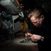 Aviation Electronics Technician Airman Adam Slakes, from Holland, Michigan, replaces components on a circuit board aboard the Nimitz-class aircraft carrier USS John C. Stennis (CVN 74).