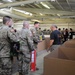 Soldiers line up to draw jump lottery ticket; donate toys