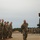 Cote d'Ivoire Army Jumpmaster congratulates U.S. paratroopers at OTD XXI