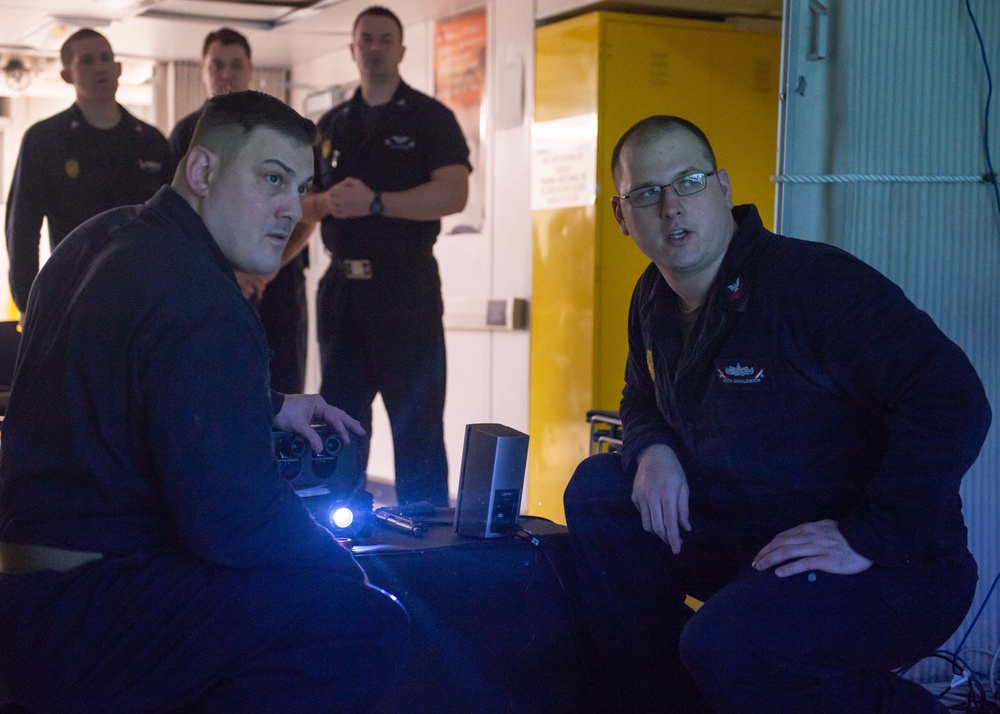 USS John C. Stennis Sailors set up a weapons training system