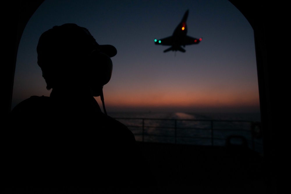 U.S. Navy Sailor stands watch on the fantail