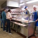 Wing leadership serves lunch before holidays