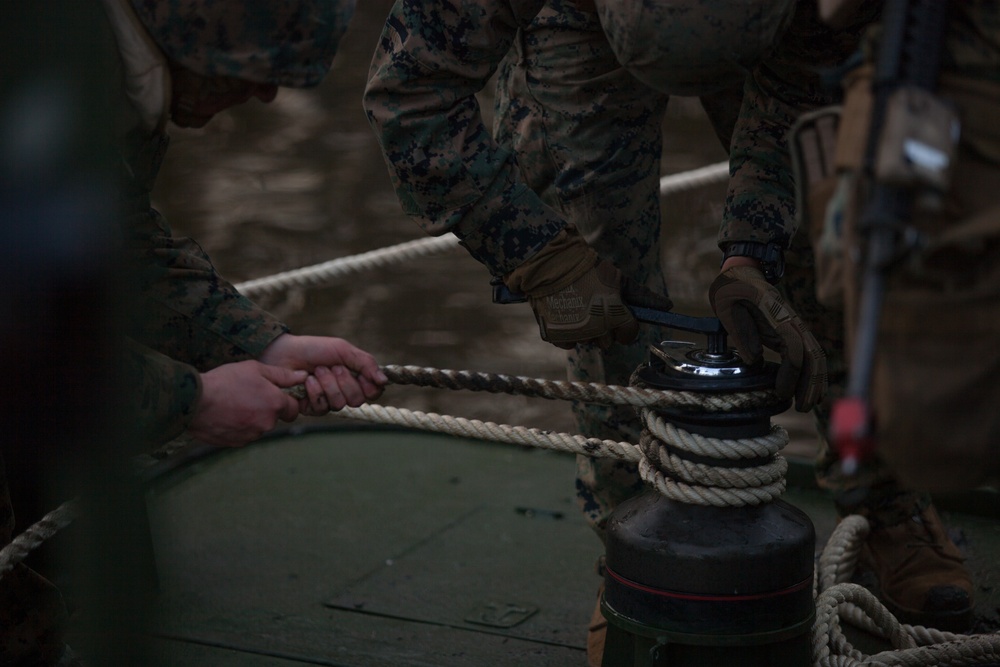 8th Engineer Support Battalion transports light armored vehicles using an improved ribbon bridge