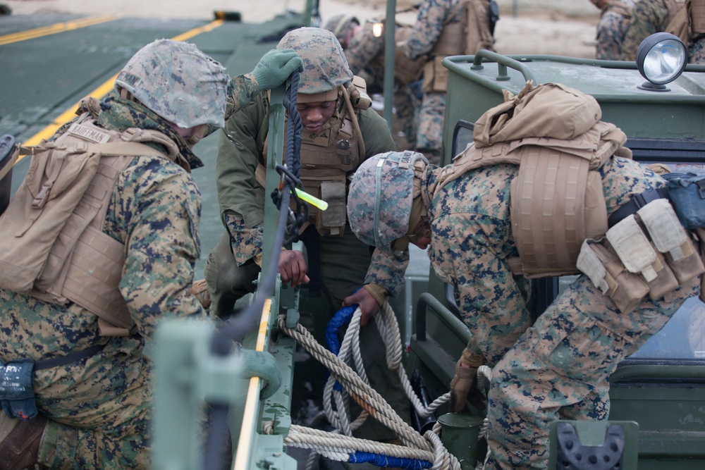 8th Engineer Support Battalion transports light armored vehicles using an improved ribbon bridge