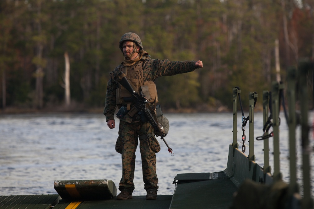 8th Engineer Support Battalion transports light armored vehicles using an improved ribbon bridge