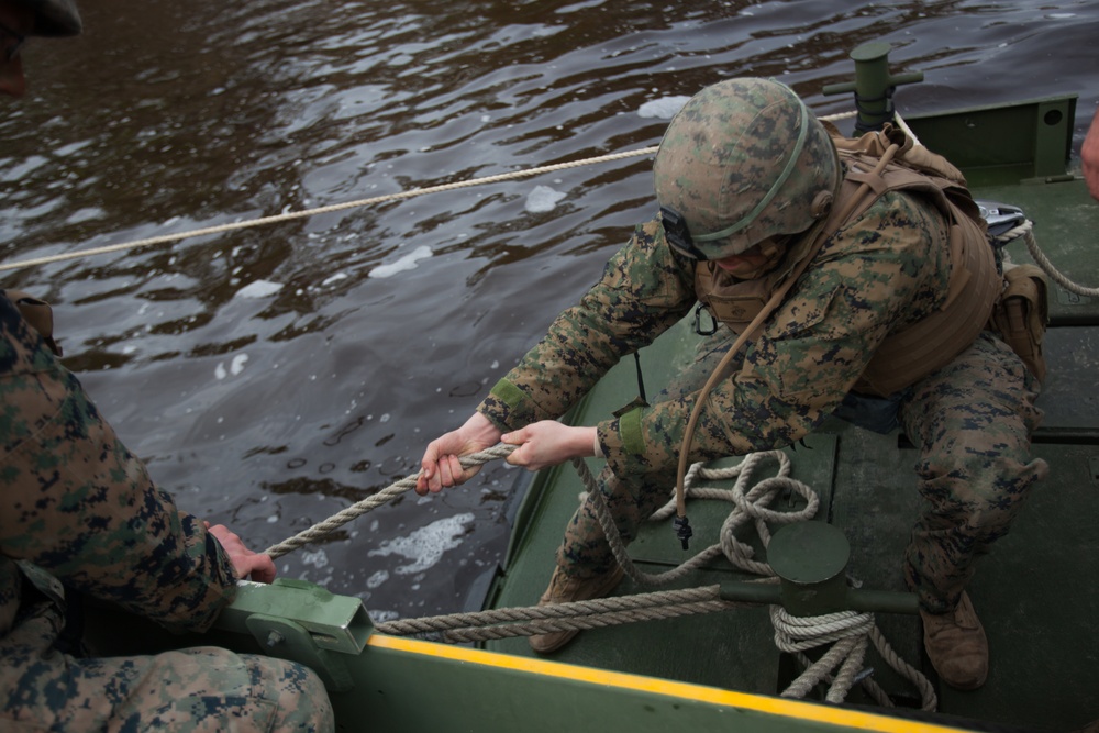 8th Engineer Support Battalion transports light armored vehicles using an improved ribbon bridge