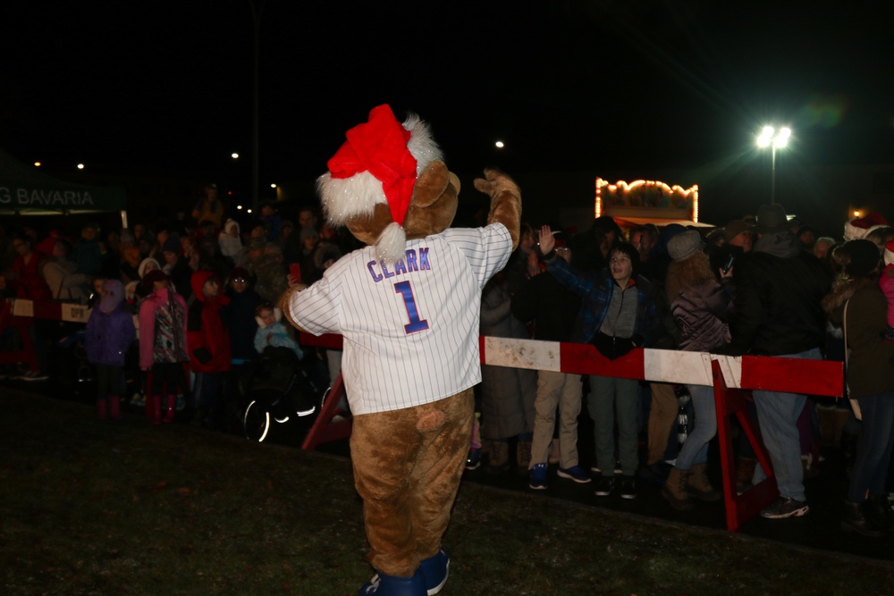 Clark, the Chicago Cubs mascot, signs a hat for a fan at the USO at USAG  Bavaria in Grafenwoehr, Germany, Dec. 11, 2018. The USO sponsored a Chicago  Cubs mascot tour of