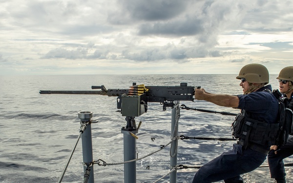 Sailor Fires .50-Caliber Machine Gun