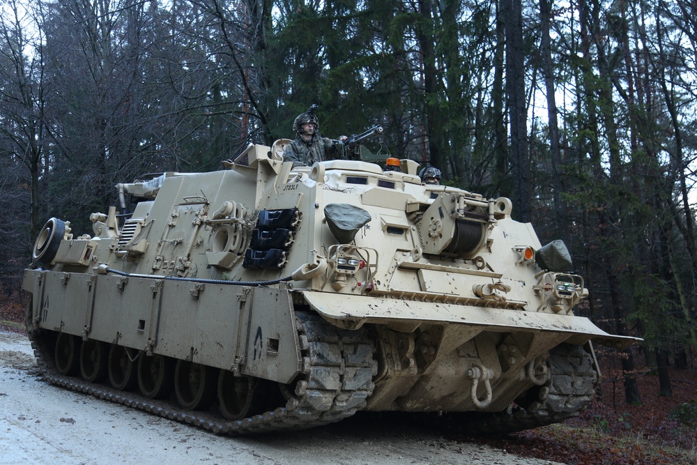 Soldiers maneuver an M88A2 Hercules recovery vehicle.