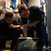 U.S. Sailors check diagrams