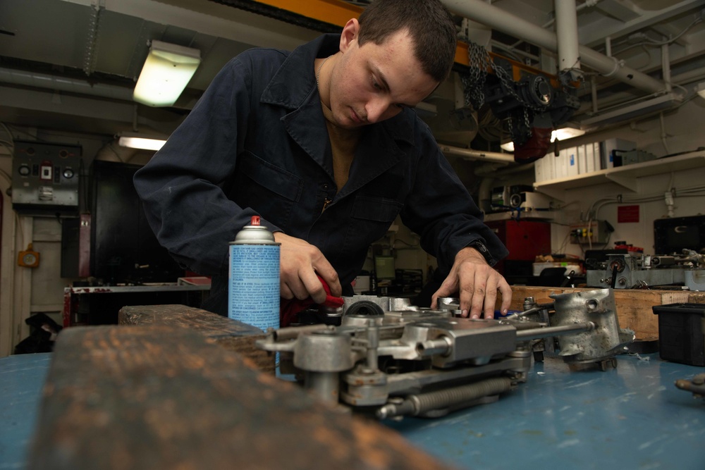 U.S. Sailor performs maintenance