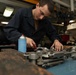 U.S. Sailor performs maintenance