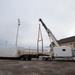 Contractors drive the special access program facility (SAPF) onto the flightline