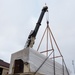 Contractors lift the special access program facility (SAPF) with a crane