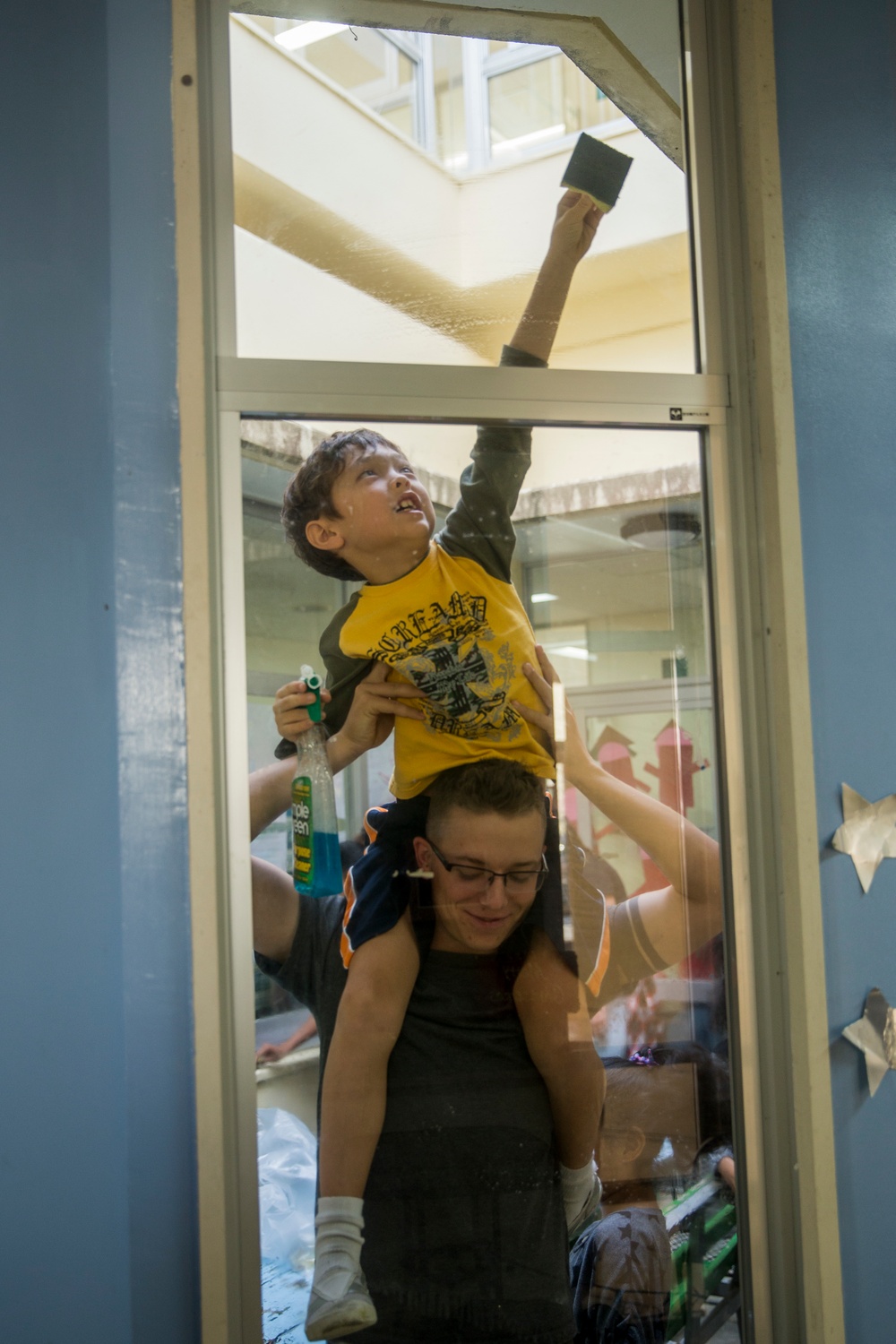 Helping Hands | Marines and Sailors with CLB-4 help clean up the AmerAsian school in Okinawa