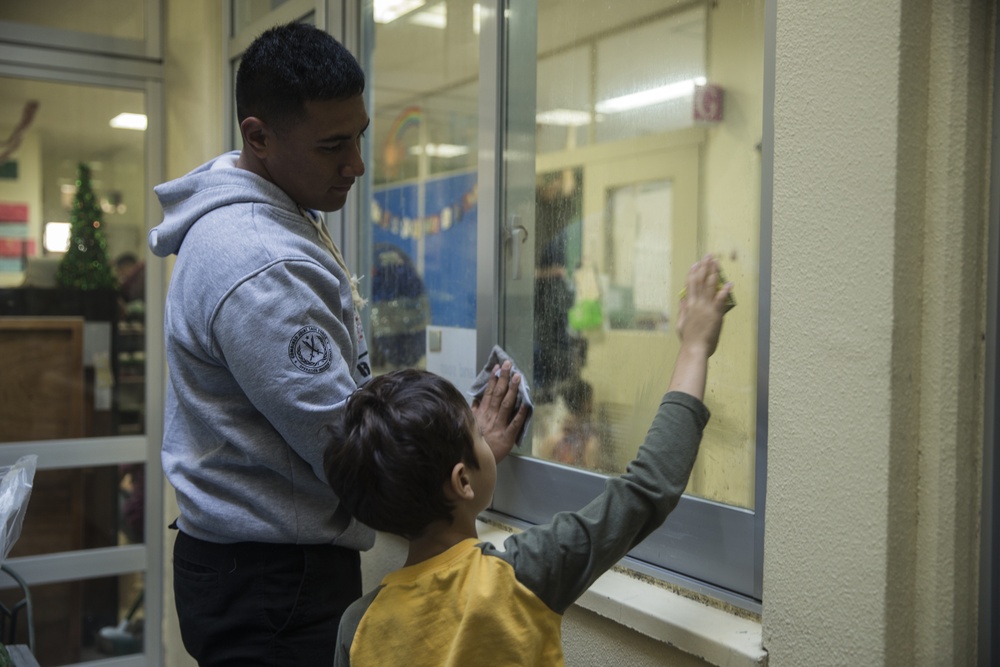 Helping Hands | Marines and Sailors with CLB-4 help clean up the AmerAsian school in Okinawa