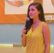 Strength in volunteering: U.S. Soldier sings in a charity game in Romania