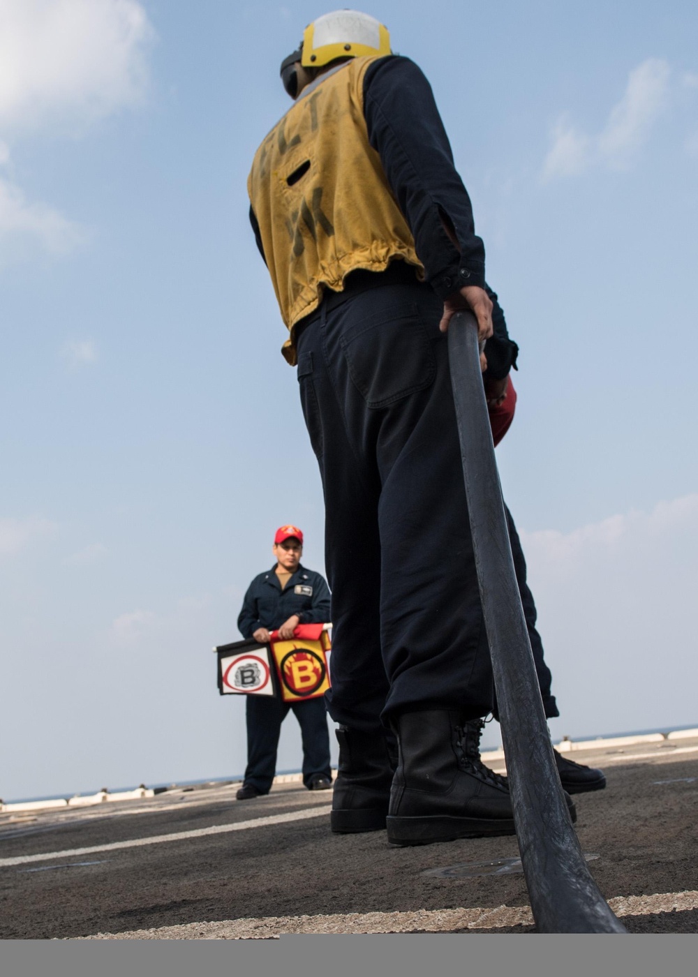 U.S. Sailors conduct a firefighting drill aboard the guided-missile cruiser USS Mobile Bay (CG 53)