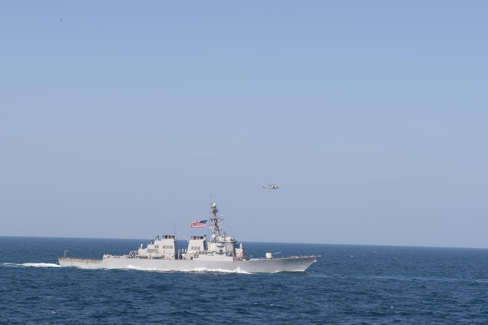 The guided-missile destroyer USS Decatur (DDG 73) sails in formation in the Arabian Sea, Dec. 14, 2018