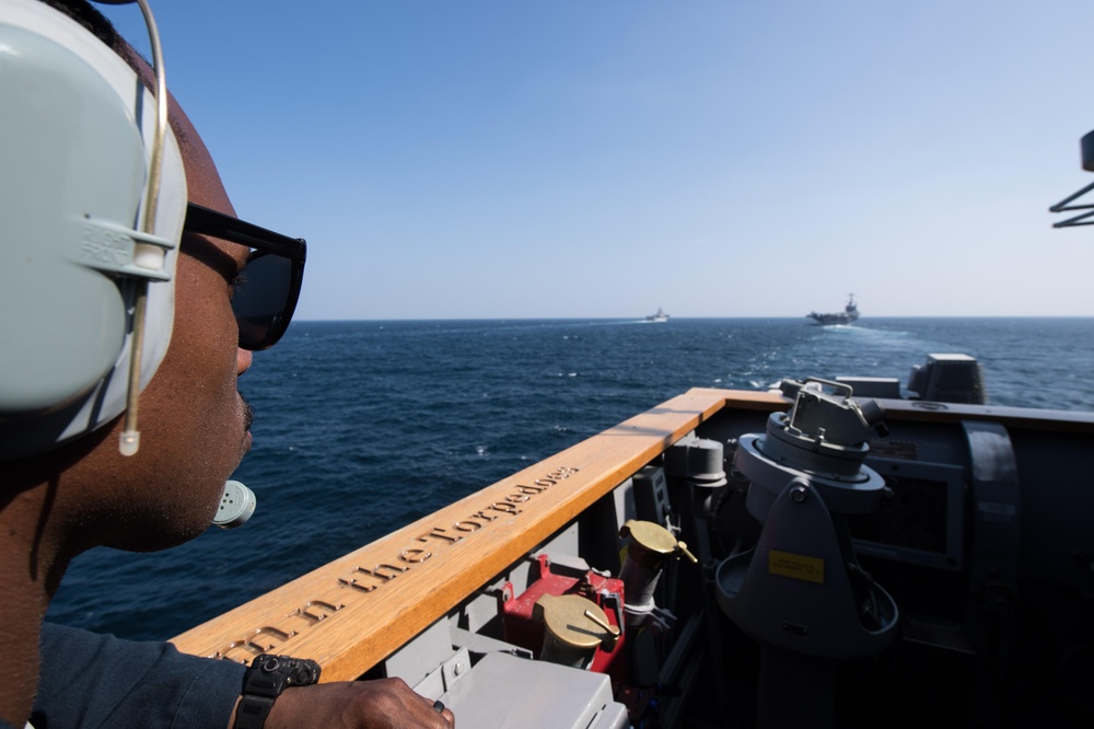 U.S Navy Seaman Kenneth Williams, from New York, stands watch aboard the guided-missile cruiser USS Mobile Bay (CG 53)