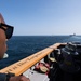U.S Navy Seaman Kenneth Williams, from New York, stands watch aboard the guided-missile cruiser USS Mobile Bay (CG 53)