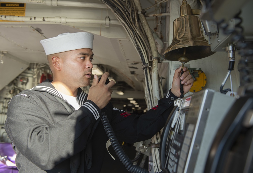 Bell Rings as Sailors Go Ashore from USS New Orleans