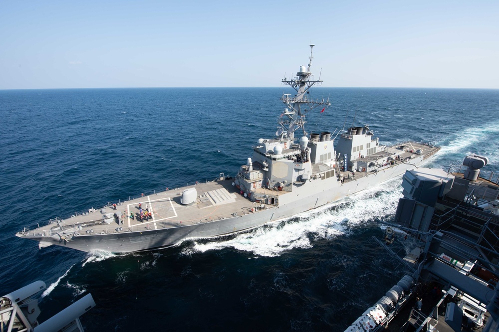 The guided-missile destroyer USS Decatur (DDG 73) sails alongside the aircraft carrier USS John C. Stennis (CVN 74)