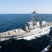 The guided-missile destroyer USS Decatur (DDG 73) sails alongside the aircraft carrier USS John C. Stennis (CVN 74)