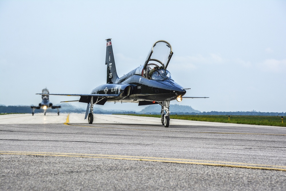 T-38 Talons taxi the runway