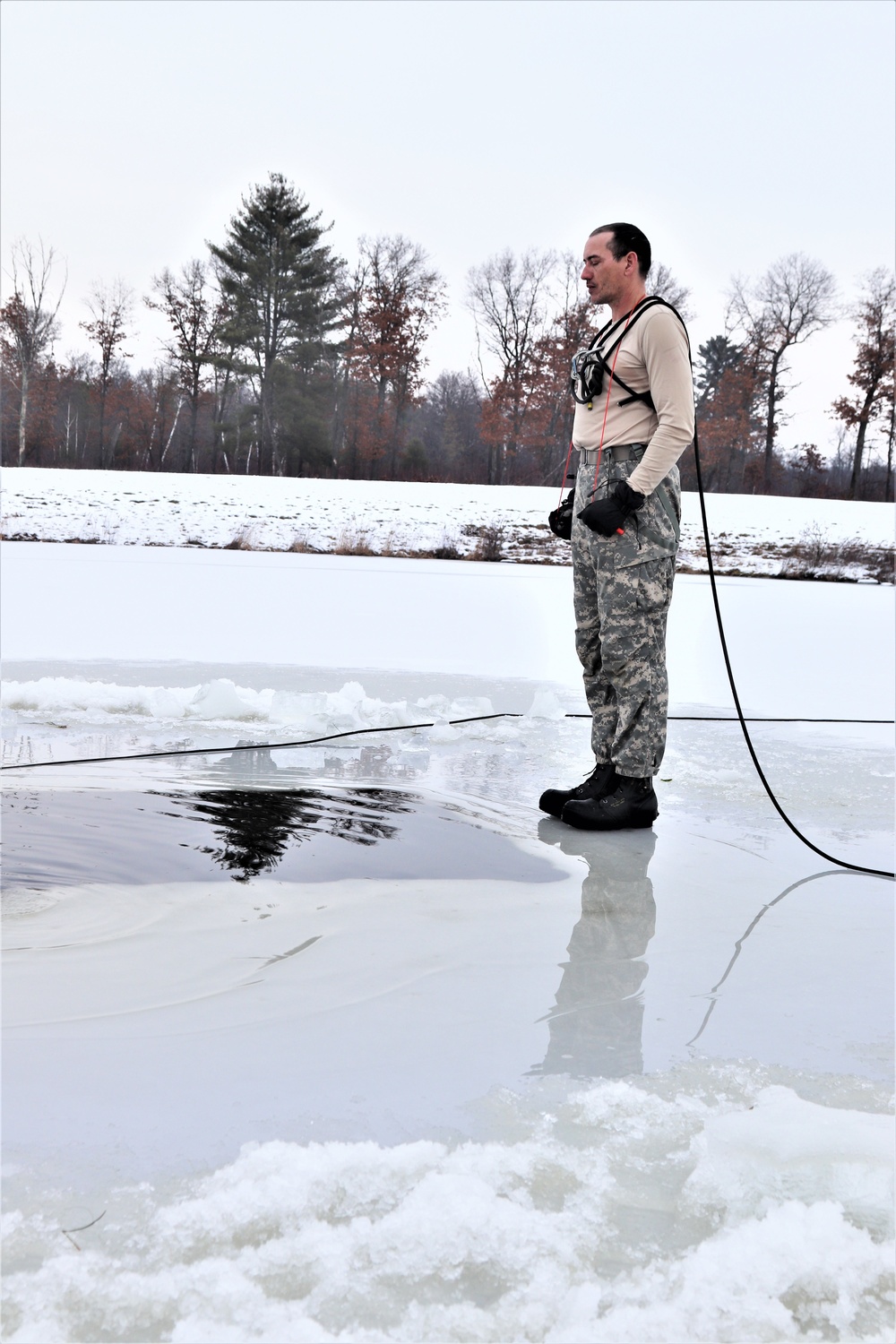 Photo Essay: Soldier takes plunge for cold-water immersion during training at Fort McCoy