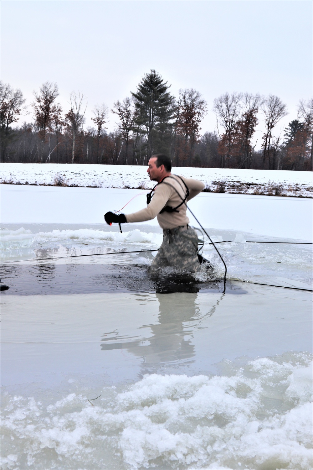 Photo Essay: Soldier takes plunge for cold-water immersion during training at Fort McCoy