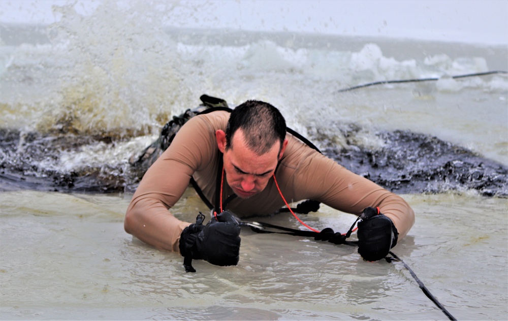 Photo Essay: Soldier takes plunge for cold-water immersion during training at Fort McCoy