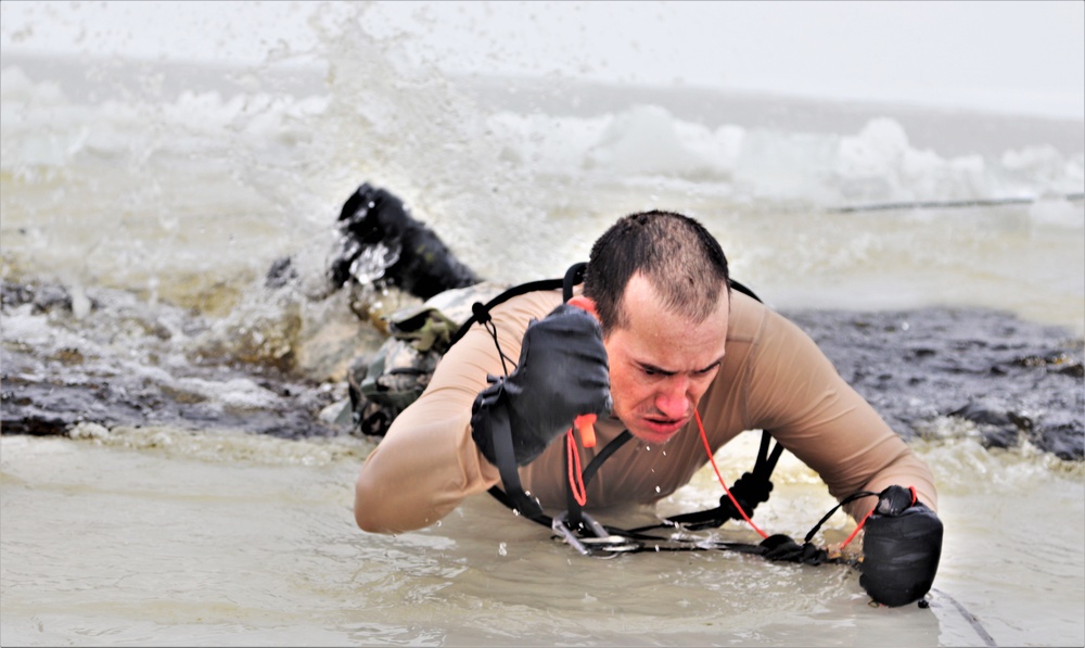 Photo Essay: Soldier takes plunge for cold-water immersion during training at Fort McCoy