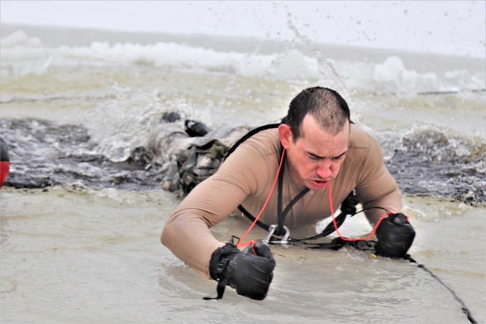 Photo Essay: Soldier takes plunge for cold-water immersion during training at Fort McCoy