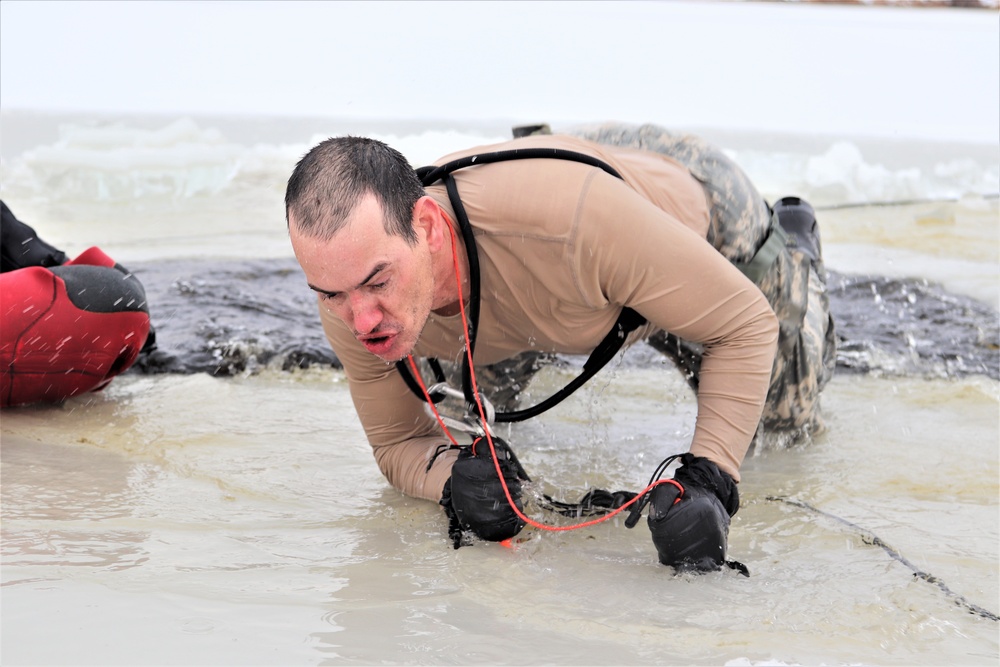 Photo Essay: Soldier takes plunge for cold-water immersion during training at Fort McCoy
