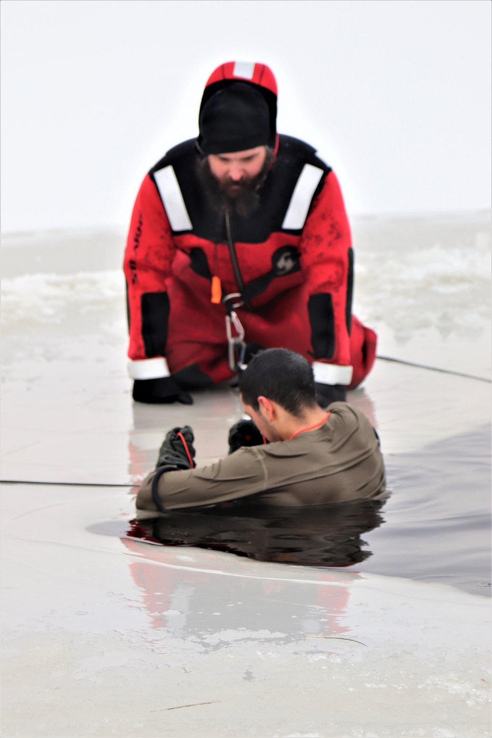 Students participate in cold-water immersion training for CWOC Class 19-01 at Fort McCoy