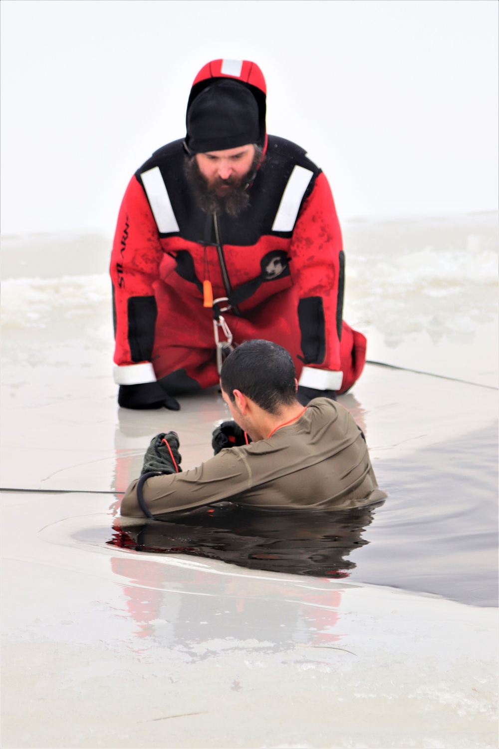Students participate in cold-water immersion training for CWOC Class 19-01 at Fort McCoy