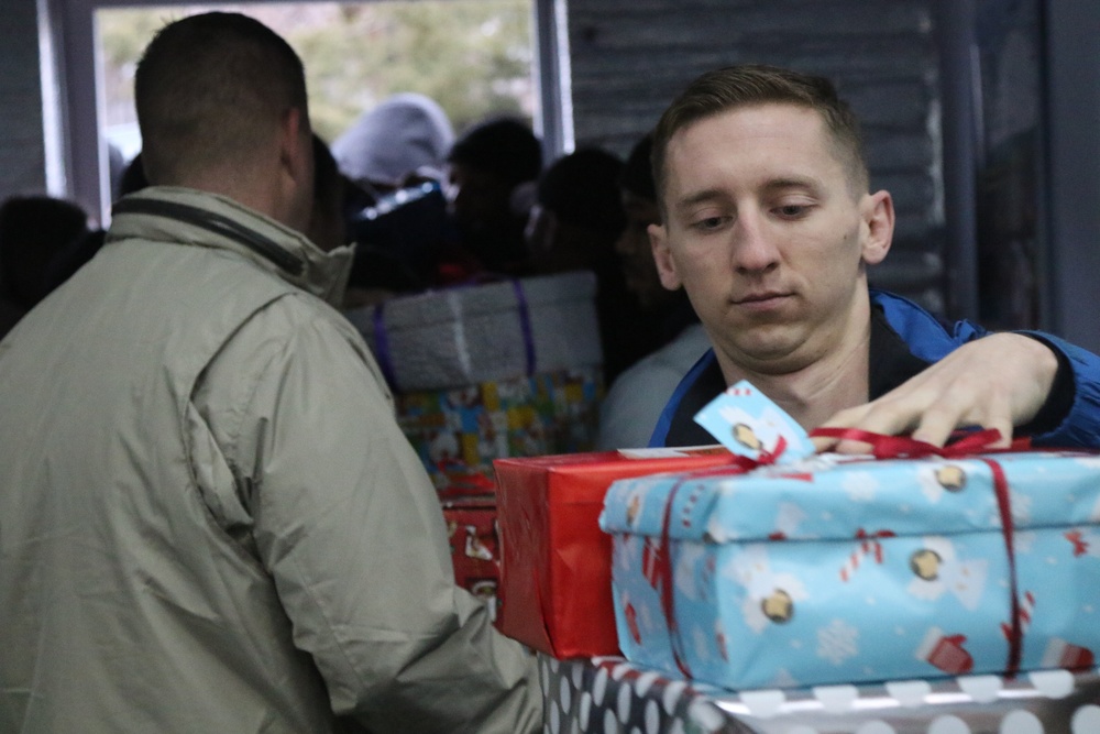 U.S. Soldiers deliver gifts to local children