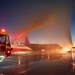 165th Airlift Wing firefighters ceremoniously spray C-130 Hercules