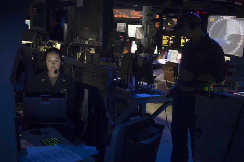 U.S. Sailors simulate anti-submarine warfare in the combat information center aboard the guided-missile destroyer USS Spruance (DDG 111)
