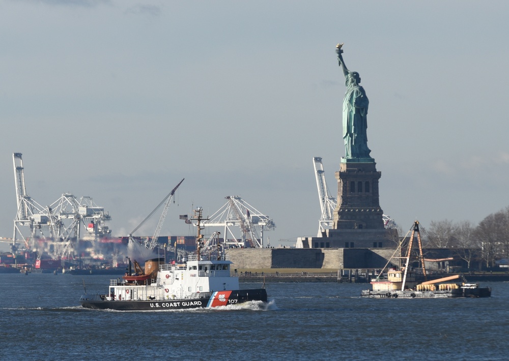 U.S. Coast Guard Cutter Penobscot Bay passes Statue of Liberty