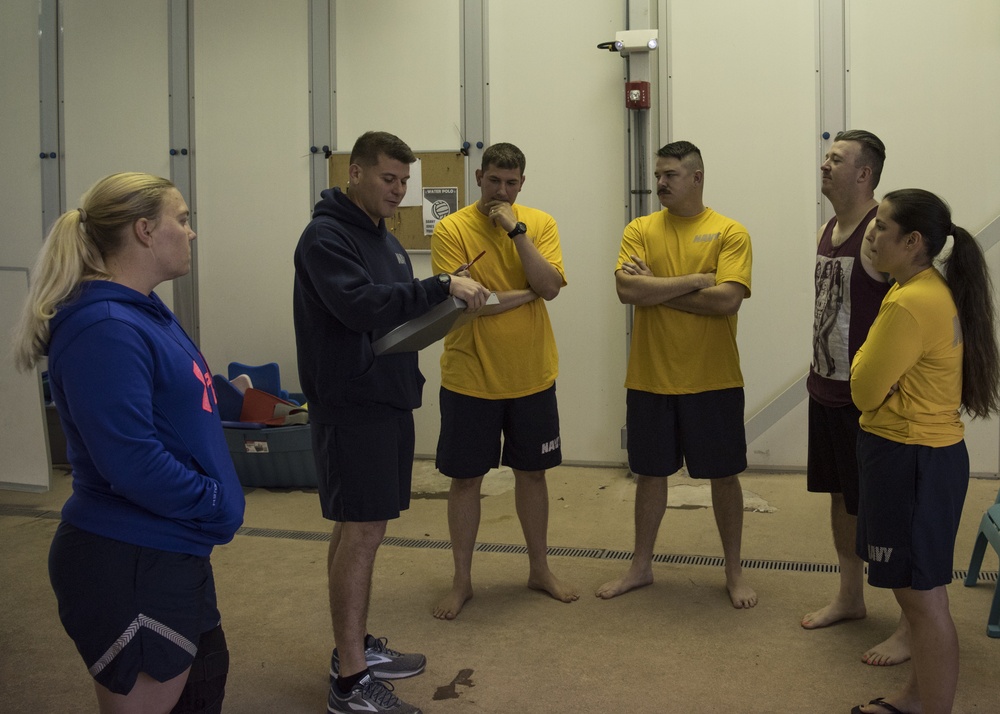 Sailors and Airmen plunge into swim qualification test