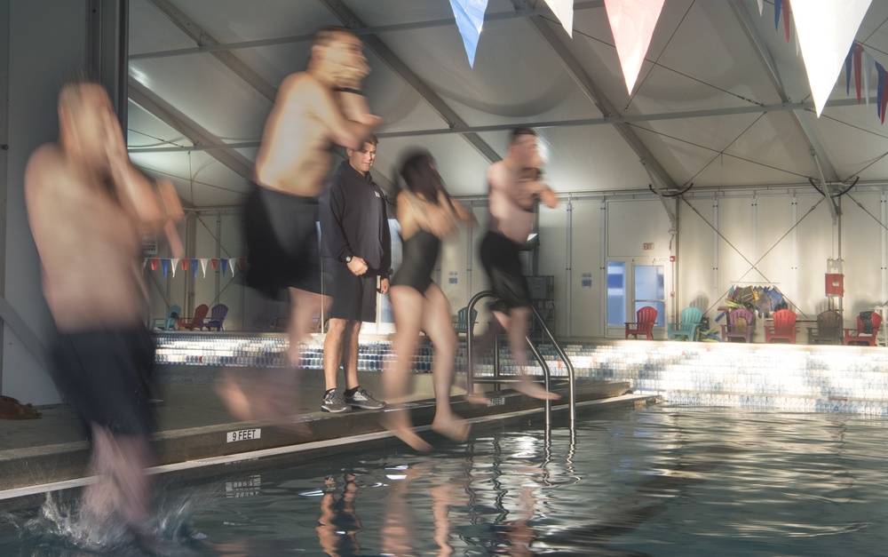 Sailors and Airmen plunge into swim qualification test