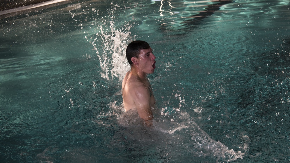 Sailors and Airmen plunge into swim qualification test